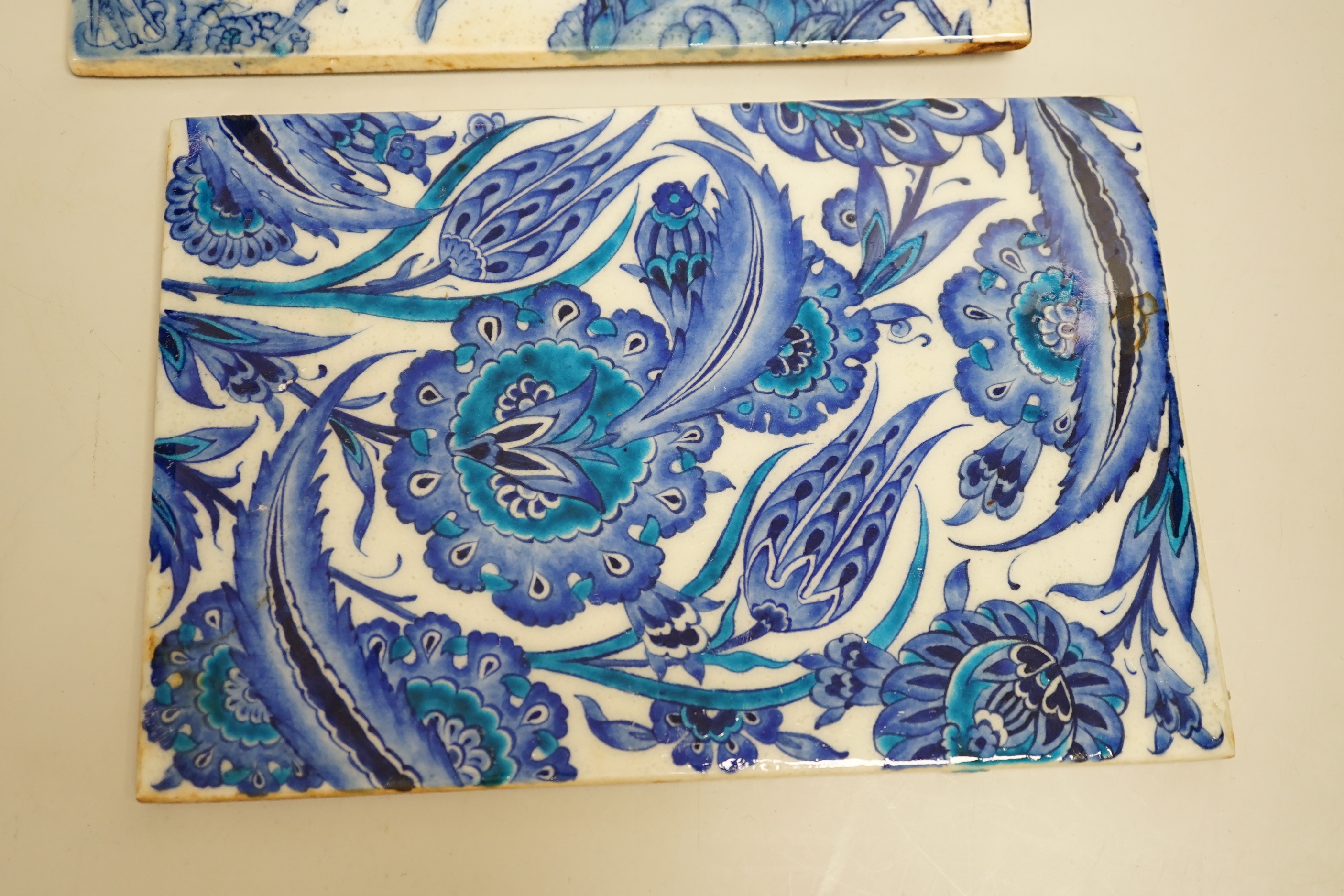 Two Turkish Iznik blue and white tiles, 24cm x 16.4cm